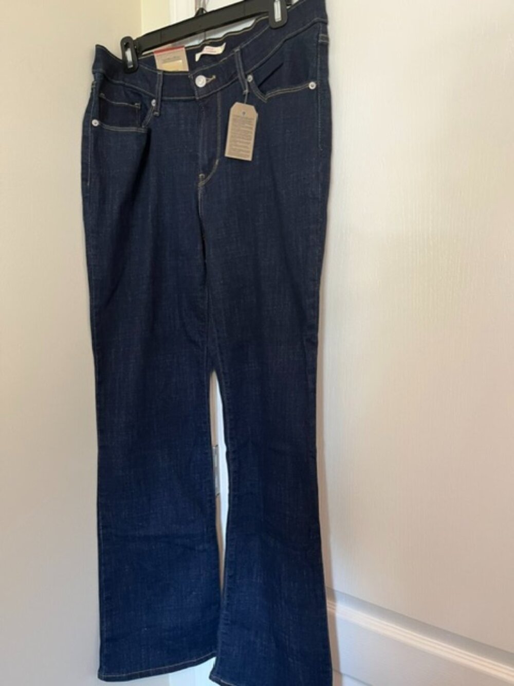 Levi Strauss dark wash classic boot cut jeans.